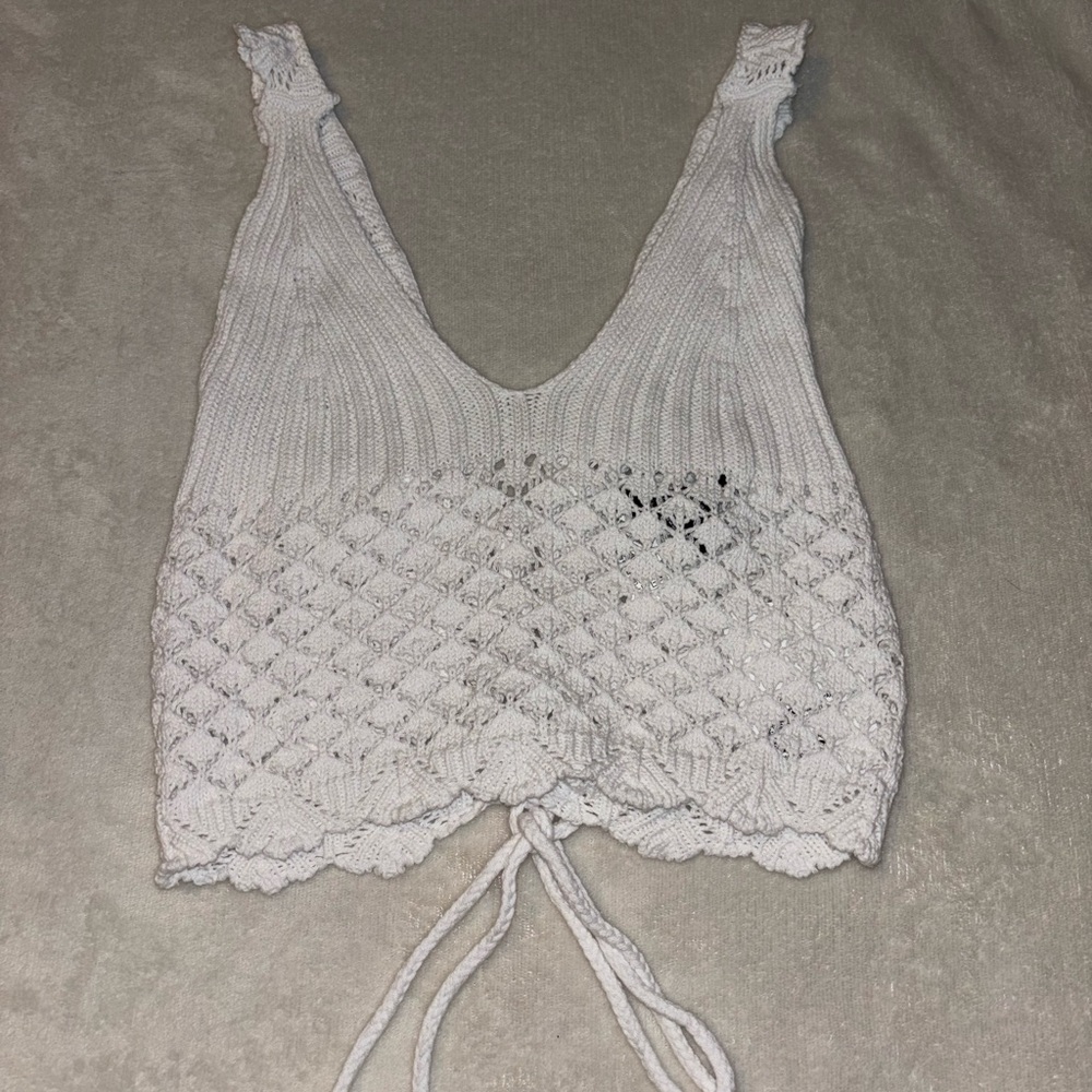 woman’s white knit top